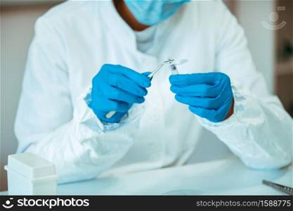 Laboratory Technician Working with Chip Implants