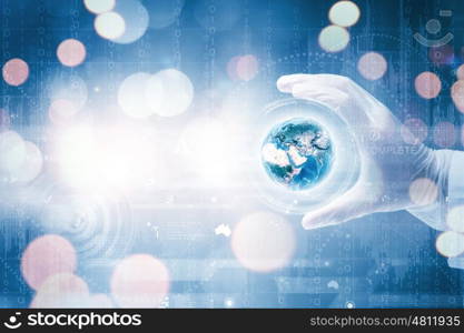 Laboratory test. Close up of scientist hand holding glass dish. Elements of this image are furnished by NASA