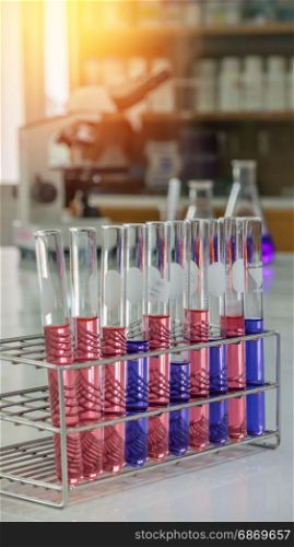 laboratory test tubes. Different laboratory test tubes with colored liquid and with reflection