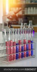 laboratory test tubes. Different laboratory test tubes with colored liquid and with reflection