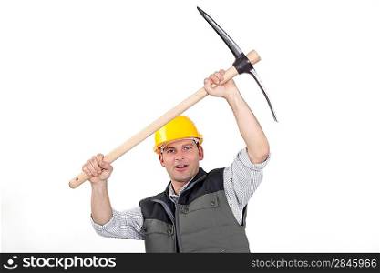 laborer carrying pickaxe