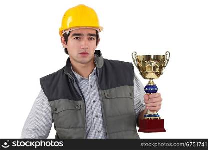 Laborer holding gold cup
