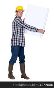 Laborer holding white sheet