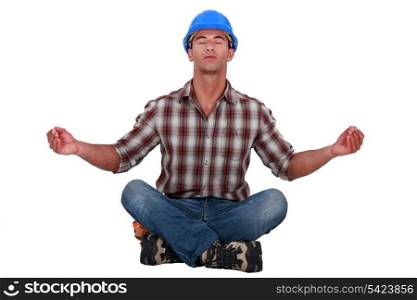 Laborer sitting in a yoga posture
