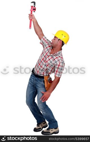 Laborer trying to hang on with a caliper