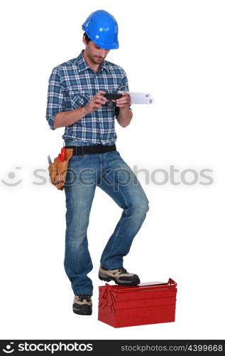 Laborer using mobile phone