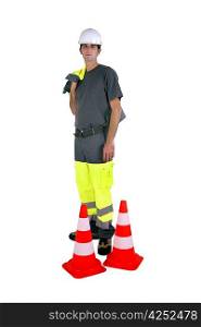 Laborer with traffic cones