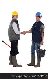 Laborers handshaking