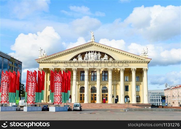Labour Union Palace of Culture, waving national flags at central October Square, Minsk, Belarus