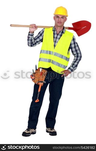 Labourer carrying a spade