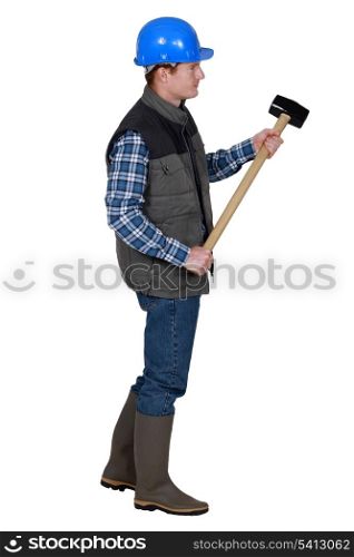 Labourer holding a mallet