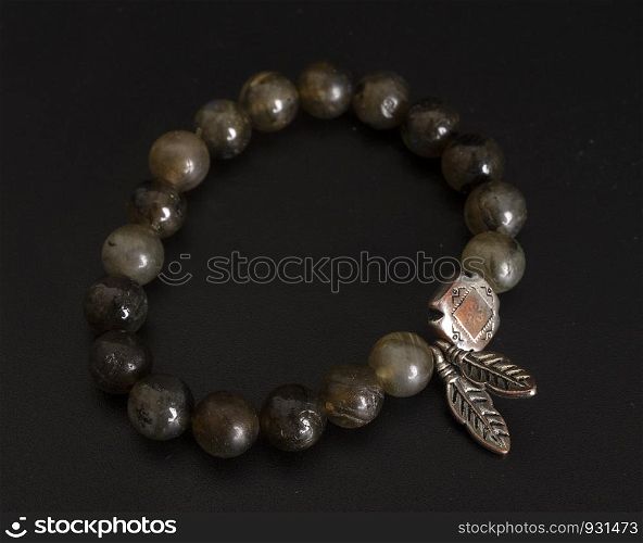 labradorite bracelet in front of black background