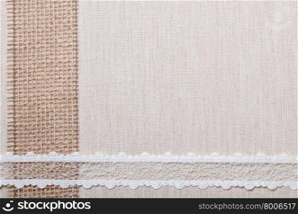 Lace frame on natural linen, bright cloth fabric background. Retro style