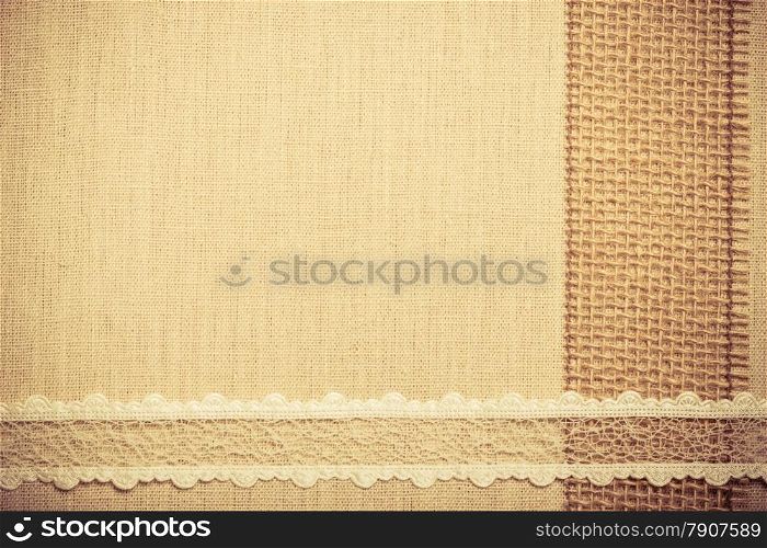Lace frame on natural linen, bright cloth fabric background. Retro vintage style