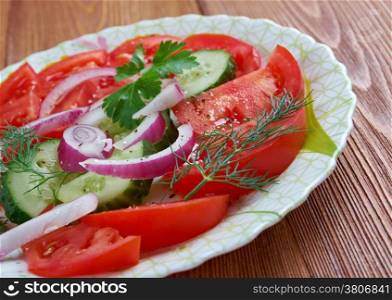 lachha - Indian salad made from cucumbers, tomatoes and onions with cilantro