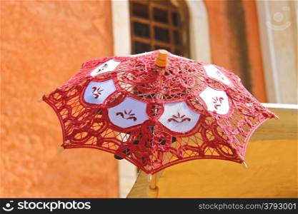 Lacy parasol for women on the counter street vendors of souvenirs in Venice, Italy