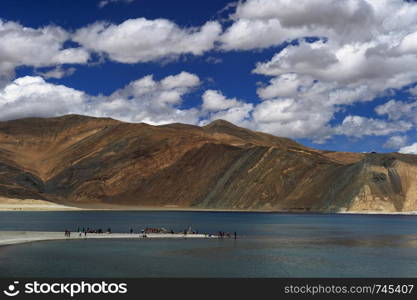 LADAKH, INDIA, July 2016, Tourist at Pangong view point.. LADAKH, INDIA, July 2016, Tourist at Pangong view point