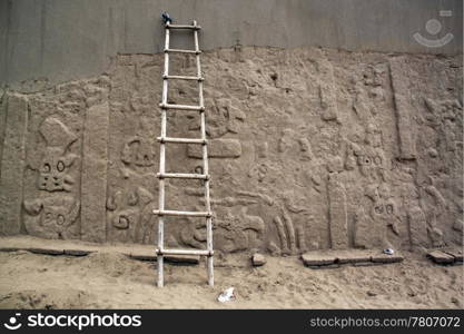 Ladder and wall of ruins in Chan Chan in Peru
