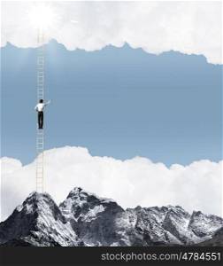 Ladder of success. Businessman standing on ladder high above mountain scene