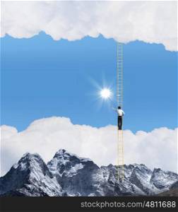 Ladder of success. Businessman standing on ladder high above mountain scene