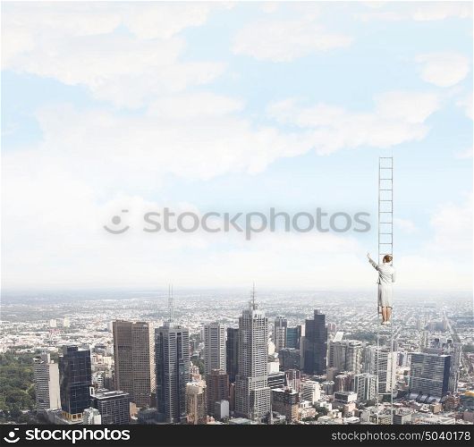 Ladder of success. Businesswoman standing on ladder high above city