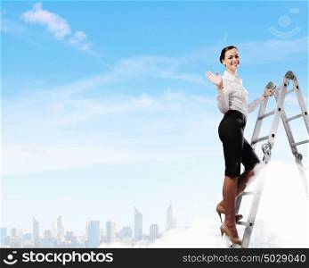 Ladder of success. Image of young ambitious businesswoman climbing ladder. Promotion concept