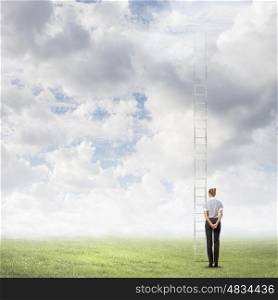 Ladder on top. Businesswoman standing with back near long ladder to sky