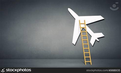 Ladder to airplane. Aircraft boarding bridge concept on blue background