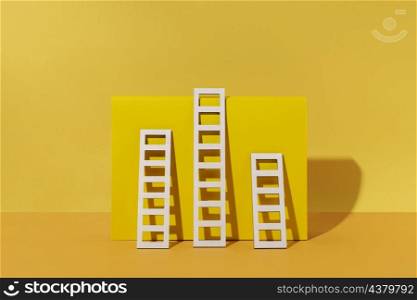 ladders arrangement with yellow background