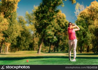 Ladies golf, beautiful young woman in golf swing