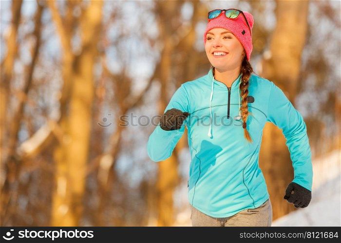 Lady exercising in w∫er clothing. How to lost weight without frostbites. Safety hea<h nature fashion fit≠ss concept. . Lady exercising in w∫er