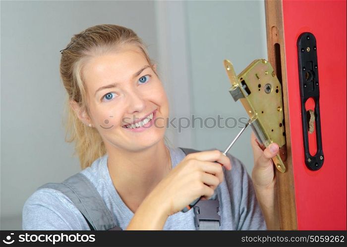 Lady fitting lock system to door
