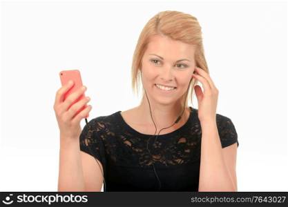 Lady holding smartphone, wearing earphones