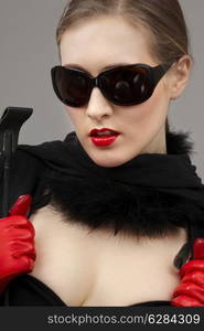 lady in black dress and red gloves with crop