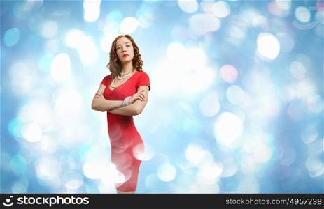 Lady in red. Young woman in red dress against bokeh background