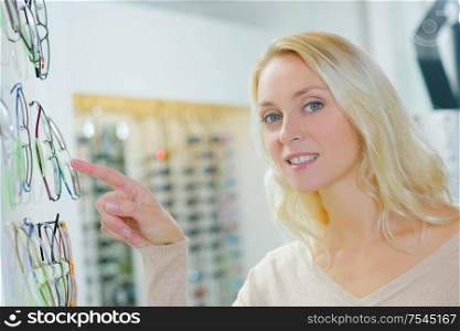 Lady pointing at spectacles