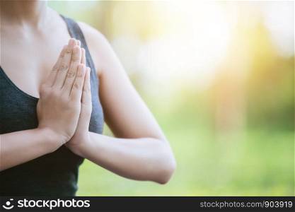 Lady practicing yoga in park outdoor, Meditation.