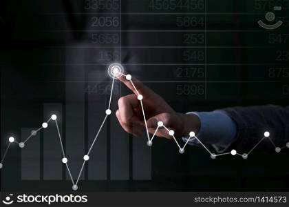Lady presenting hand blue glow futuristic modern technology tech graph economy look. Businessman hand touching rising economy graph on virtual screen business, financial investment success concepts hand point network, futuristic. blue glow futuristic modern technology tech look.
