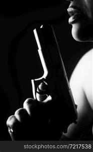 Lady spy detective holding pistol gun.