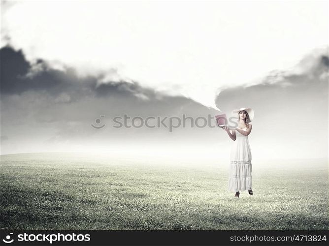 Lady using laptop. Young lady outdoor with laptop in hands