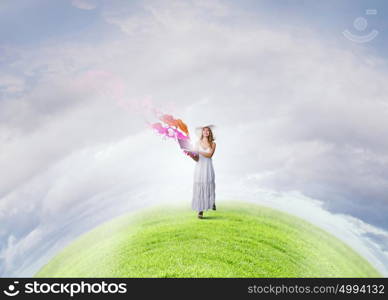 Lady using laptop. Young lady outdoor with laptop in hands