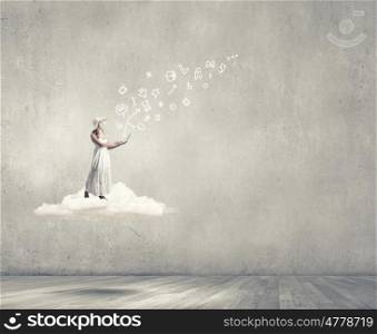 Lady using laptop. Young lady standing on cloud and using laptop