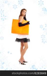 lady with orange shopping bag and snowflakes