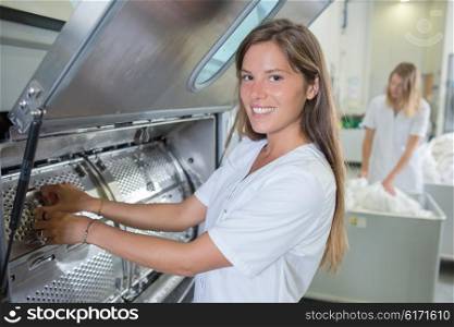 Lady working in industrial laundry