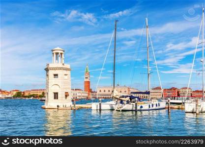 Lagoon of Venice, lighthouse and boats, beautiful italian view.