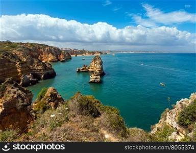 Lagos town summer coastline (Ponta da Piedade, Algarve, Portugal). All people are unrecognizable.