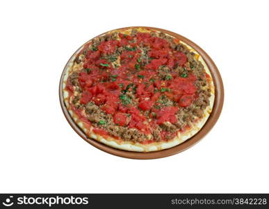 Lahmacun - round, thin piece of dough topped with minced meat and minced vegetables