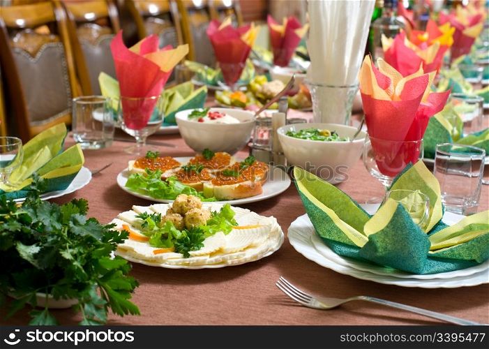 laid table with tableware and dishes, ready for banquet, shallow DOF