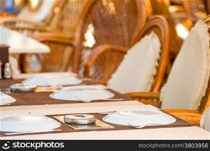 laid tables in a summer cafe in the resort