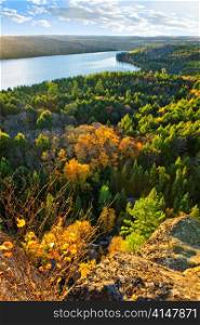 Lake and fall forest with colorful trees from above in Algonquin Park, Canada